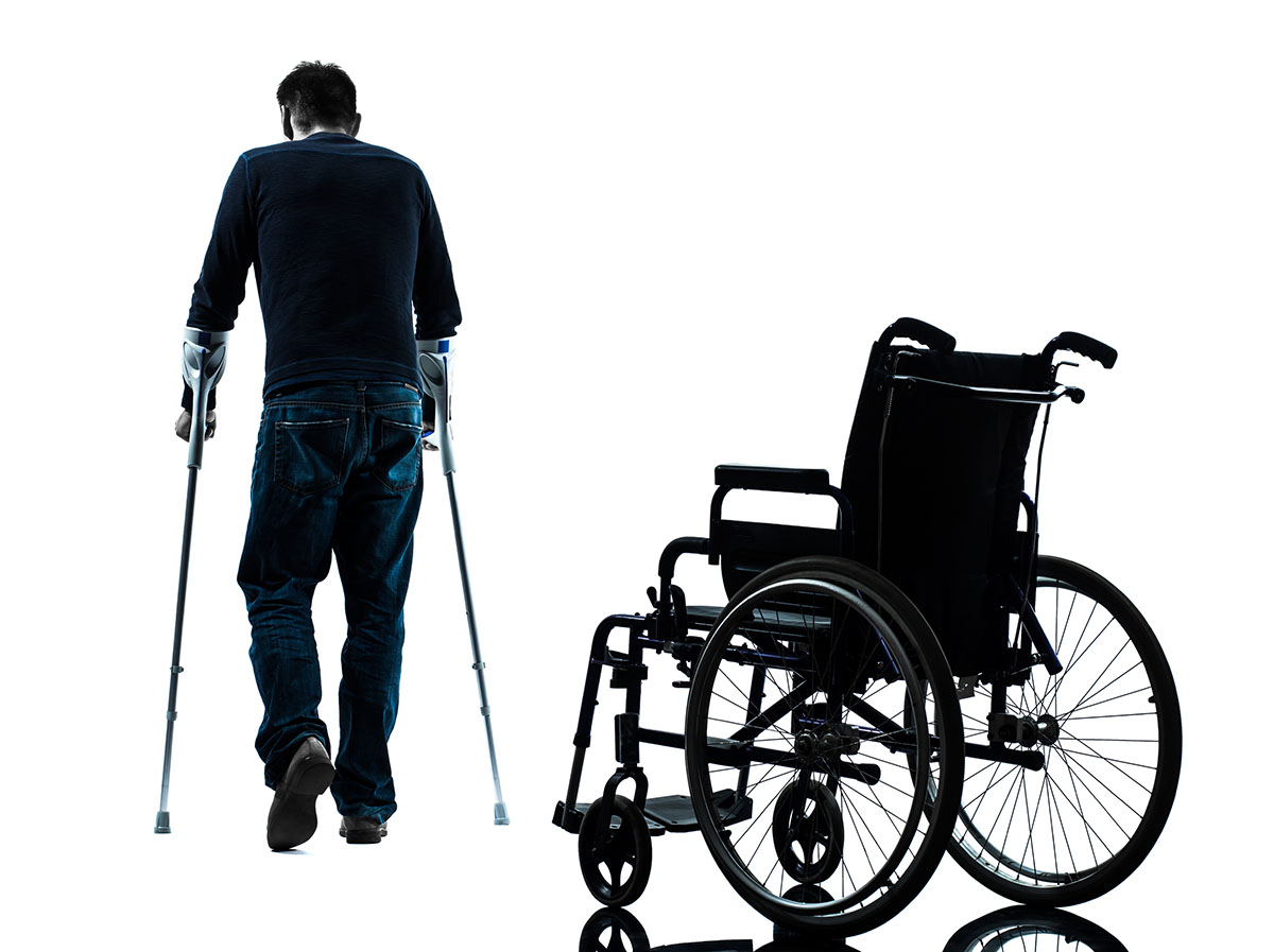 Man with wheelchair and crouches