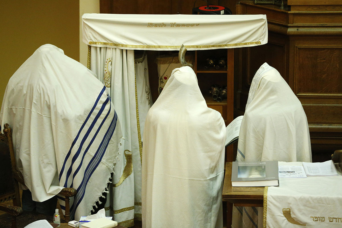 Observant Jews gathring at synagogue for Yom Kippur